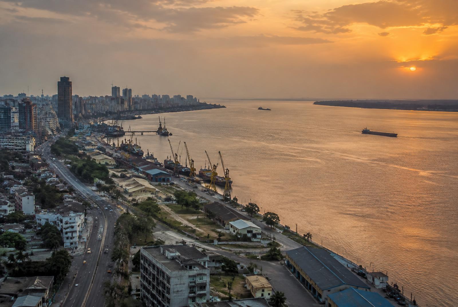 Kinshasa, the Congo River and urban port infrastructure at sunset